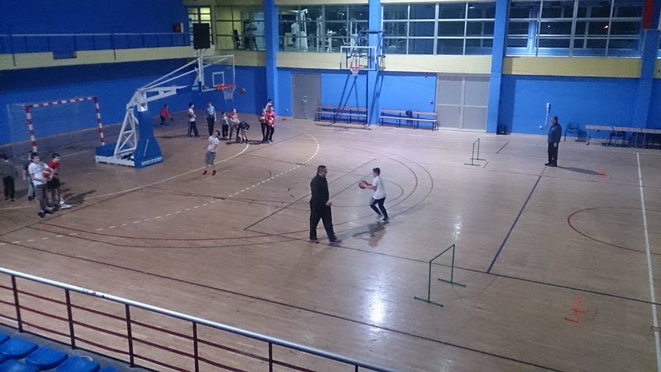 Coach working with a young player